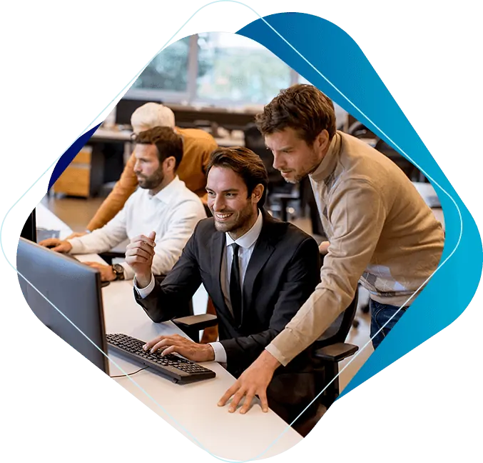 IT team collaborating at workstations connected to a central server